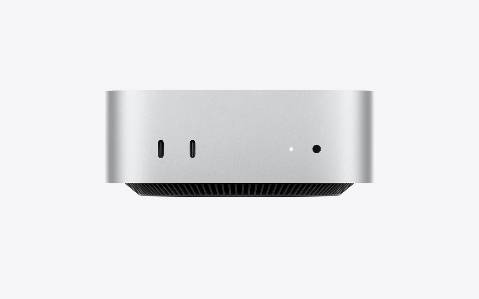 Mac mini 정면. 전면에 USB-C 2개와 헤드폰 잭